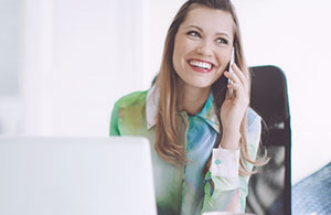 Woman smiling talking on phone