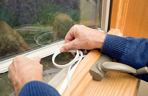 Adding weather stripping to a window