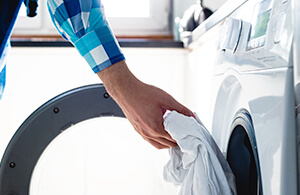 Person taking clothes out of dryer