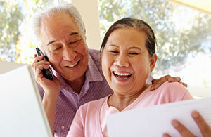 Couple looking at invoice smiling